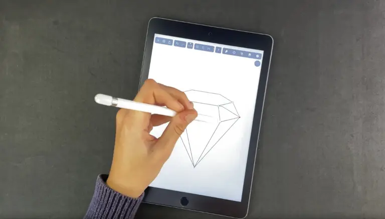 Hand drawing a diamond with a stylus on a tablet