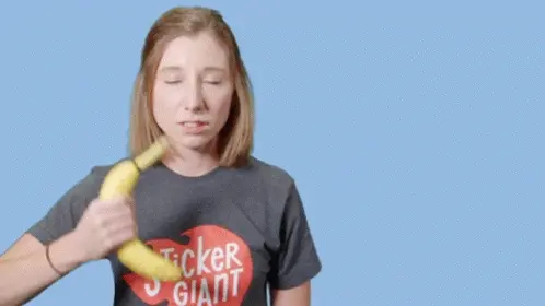Woman brushing hair with a banana.