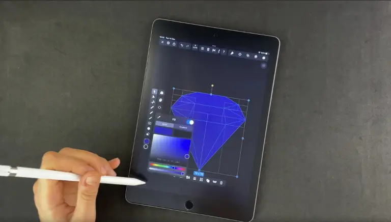 Hand using stylus to color a diamond drawing on a tablet