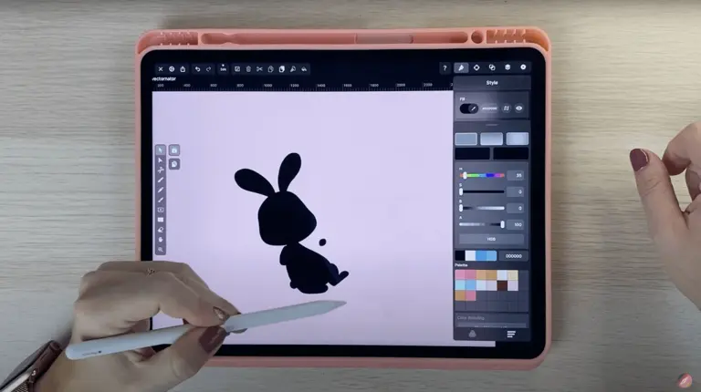 Drawing on a tablet of a cartoon beaver with a beverage