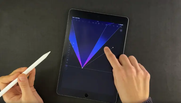 Hand holding a stylus and another hand touching a diamond graphic on a tablet screen
