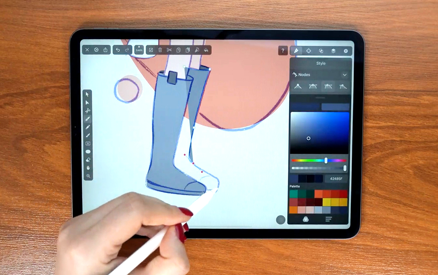Hand drawing on a tablet with a stylus in a vector design app.