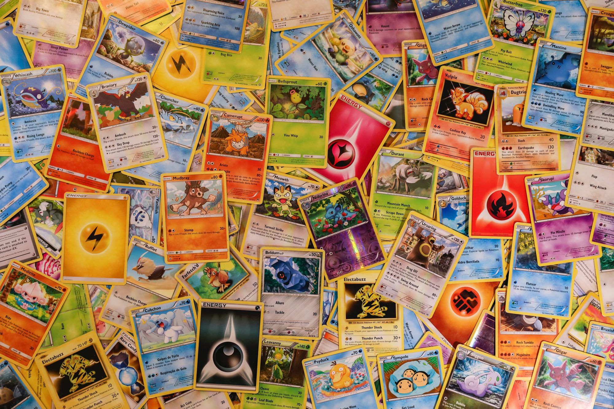 Collection of colorful trading cards scattered across the surface