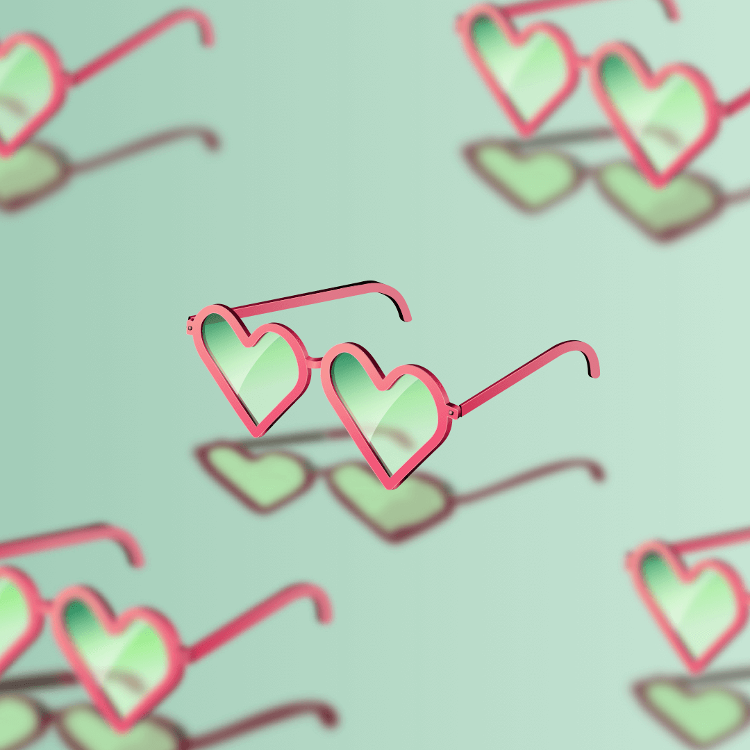 Heart-shaped sunglasses floating over a similar patterned background