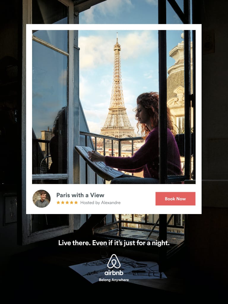 An image of a woman at a window with the Eiffel Tower in the background