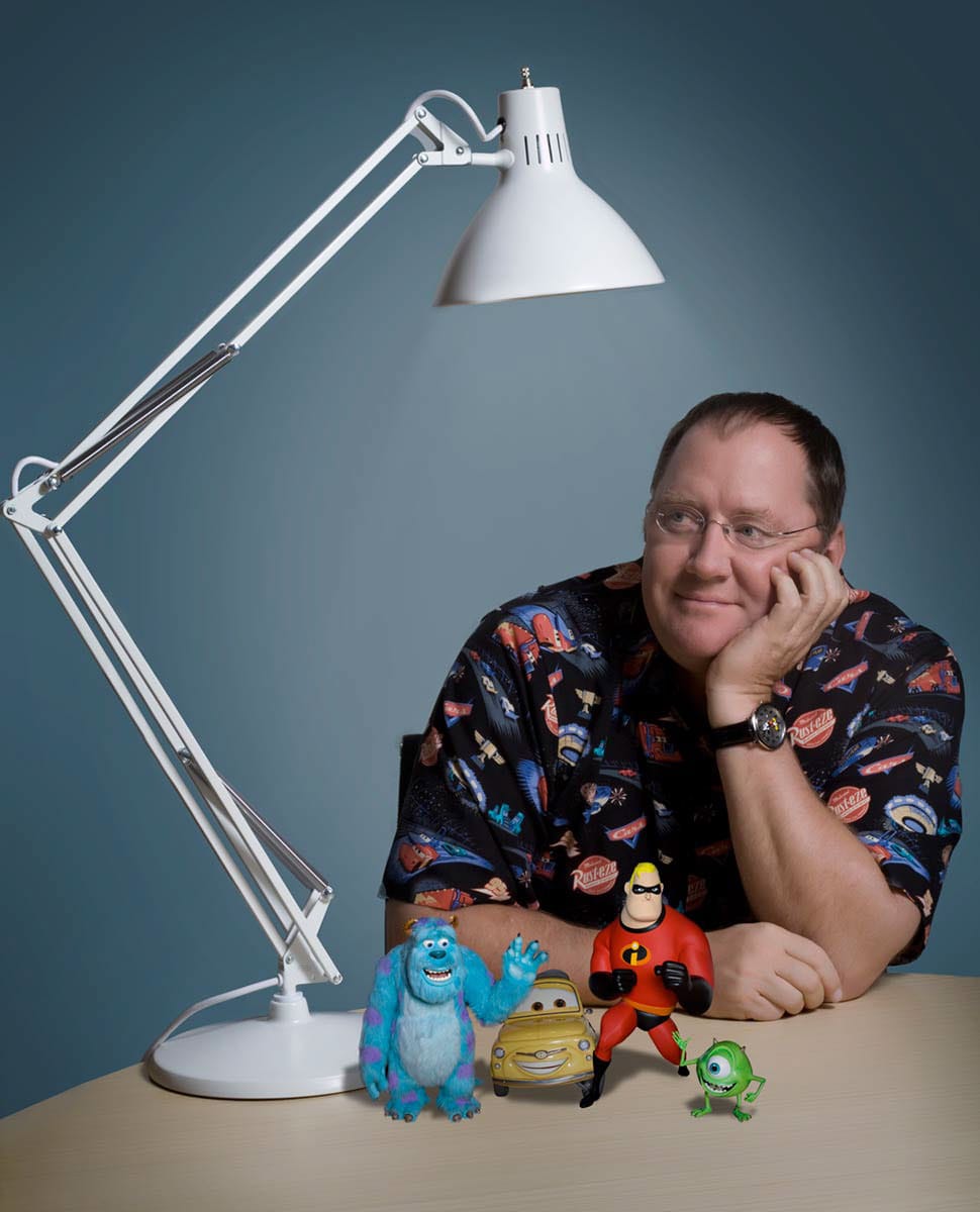 image of John Lasseter with some of his animated creations from Pixar movies