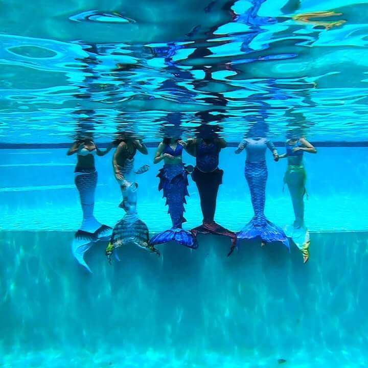 Mermaid tails in pool